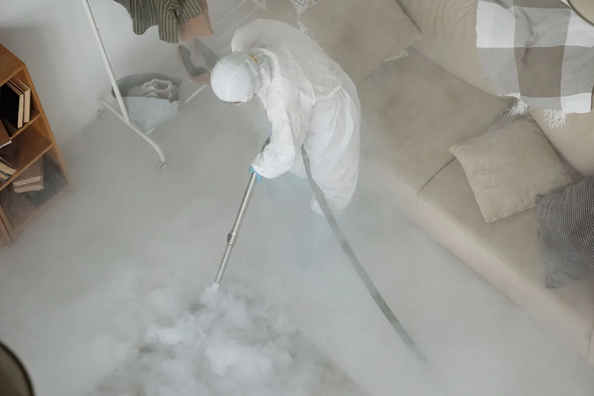 Biohazard cleanup technician in protective equipment, Eustis, FL